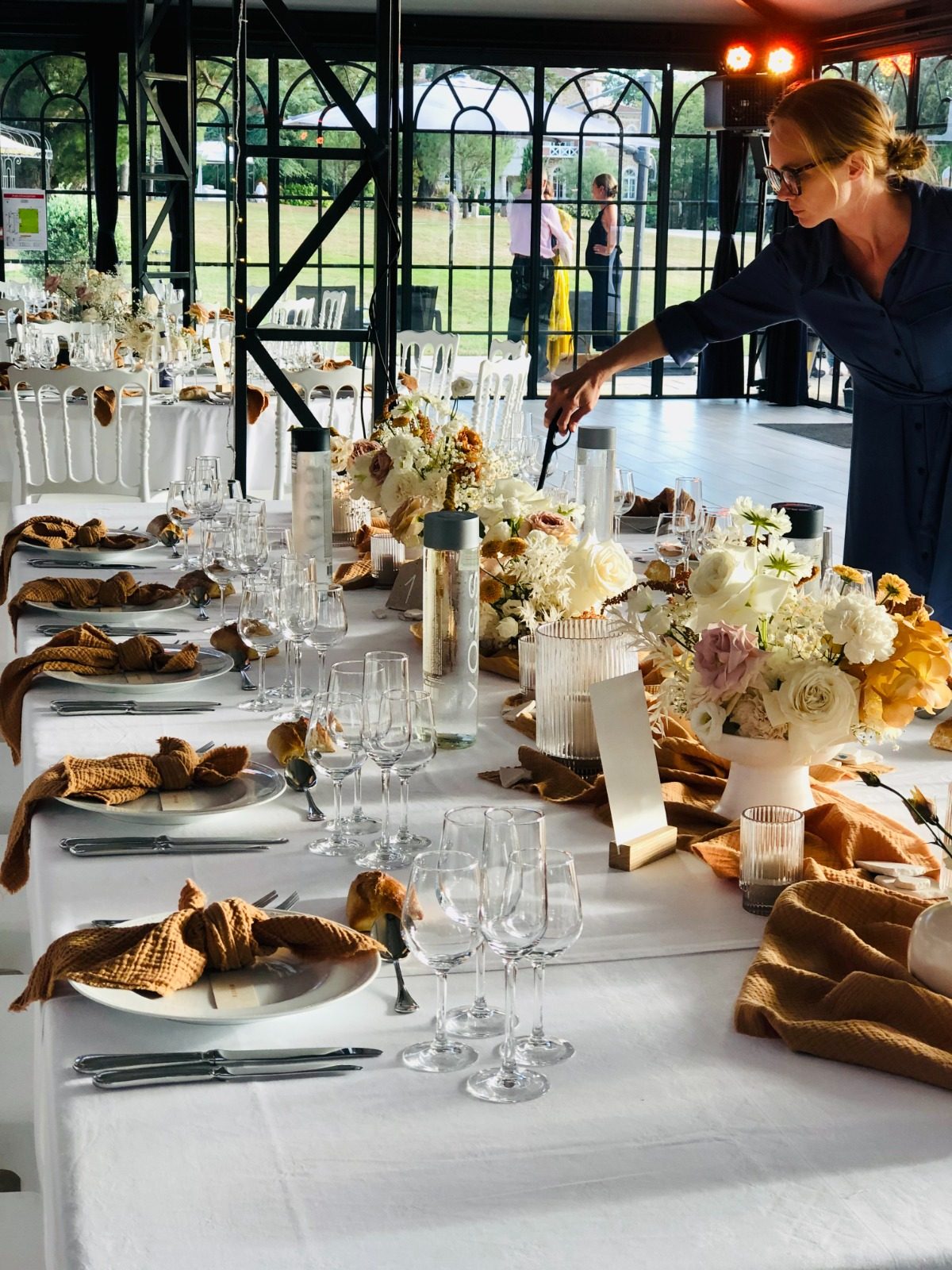 A long table laid for a private wedding celebration catered by Deb's