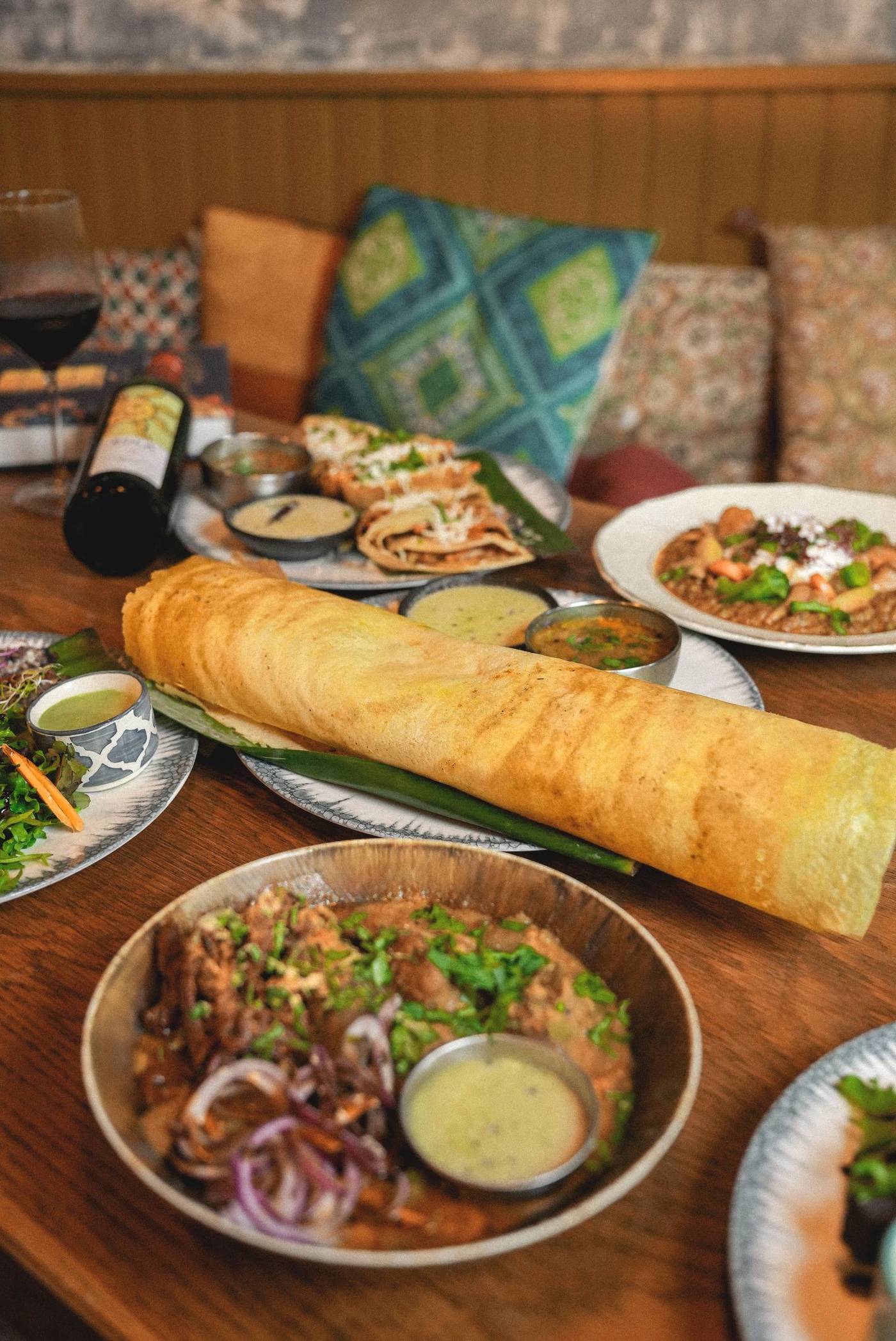 A shared table of regional Indian dishes at Deb's Bistro